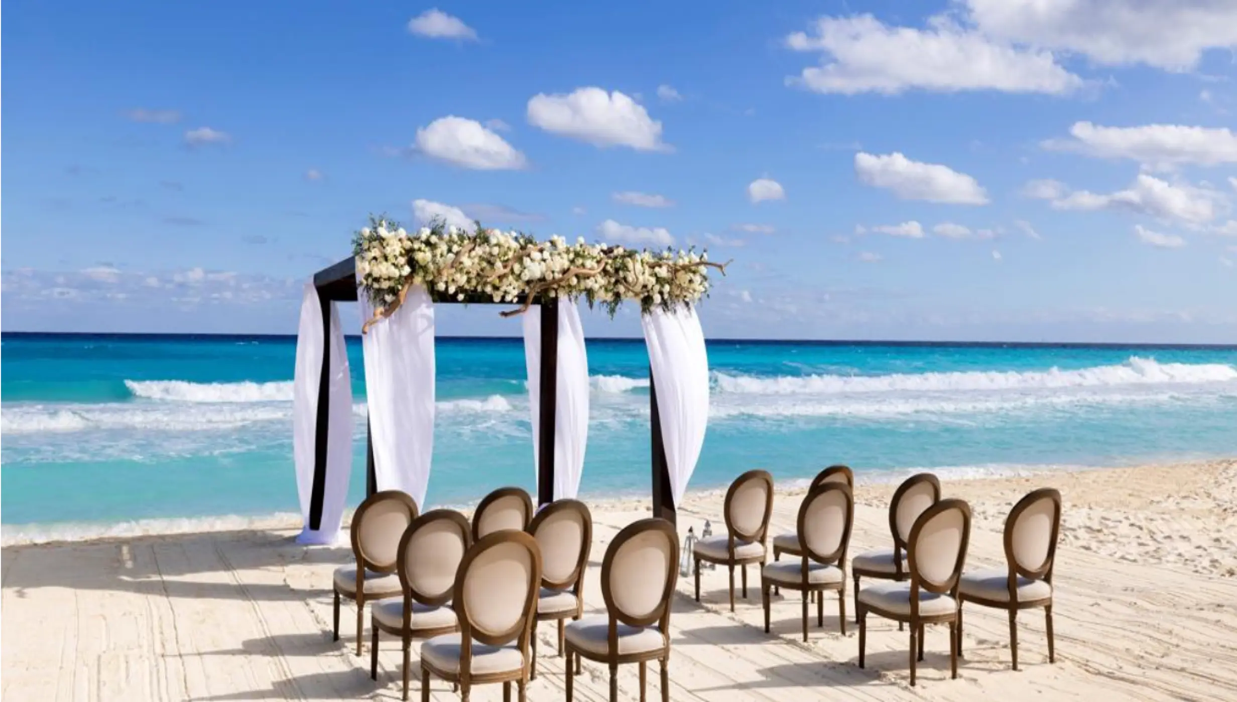 Ceremony decor on the beach wedding venue at Paradisus Cancun