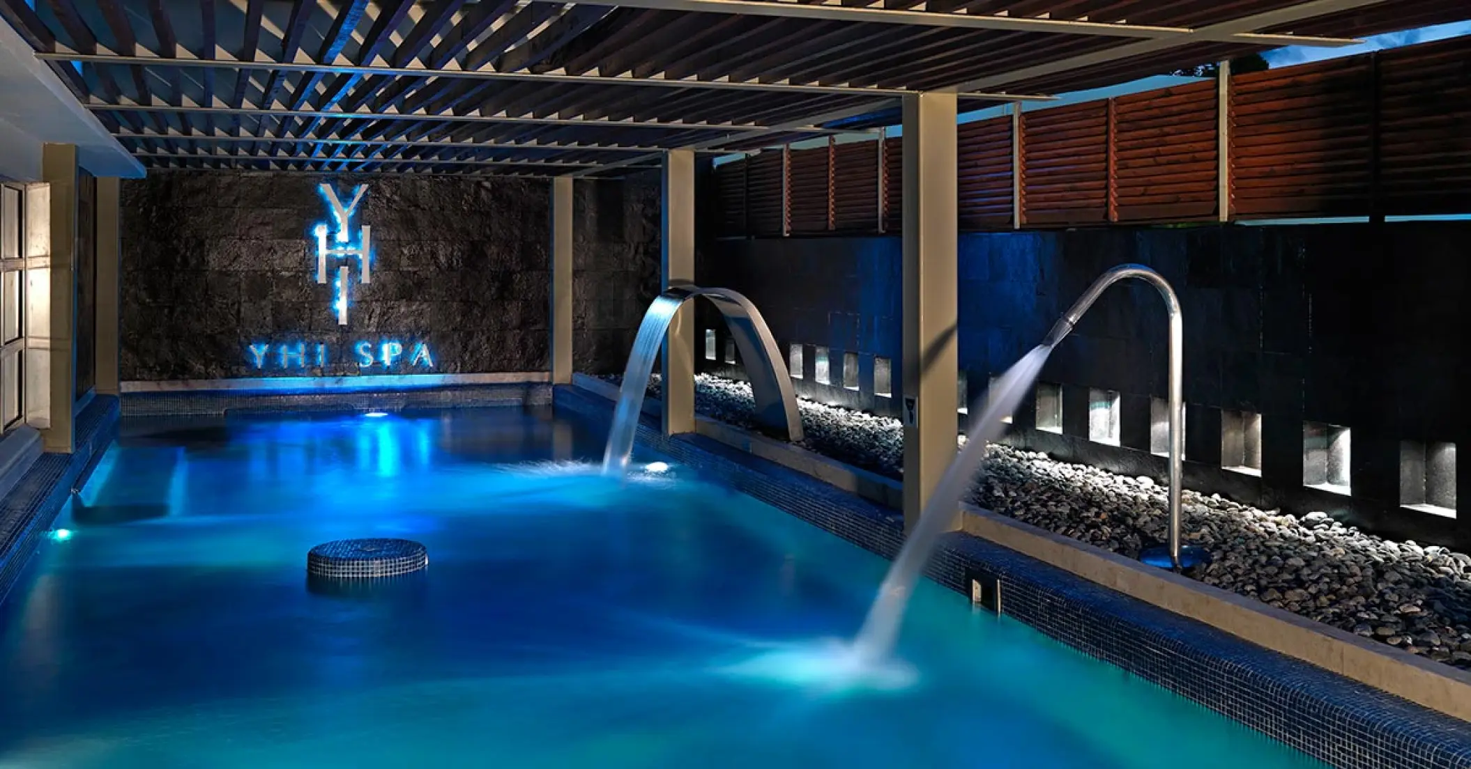 YHI Spa indoor hydrotherapy pool with swan neck fountains at Paradisus Cancun