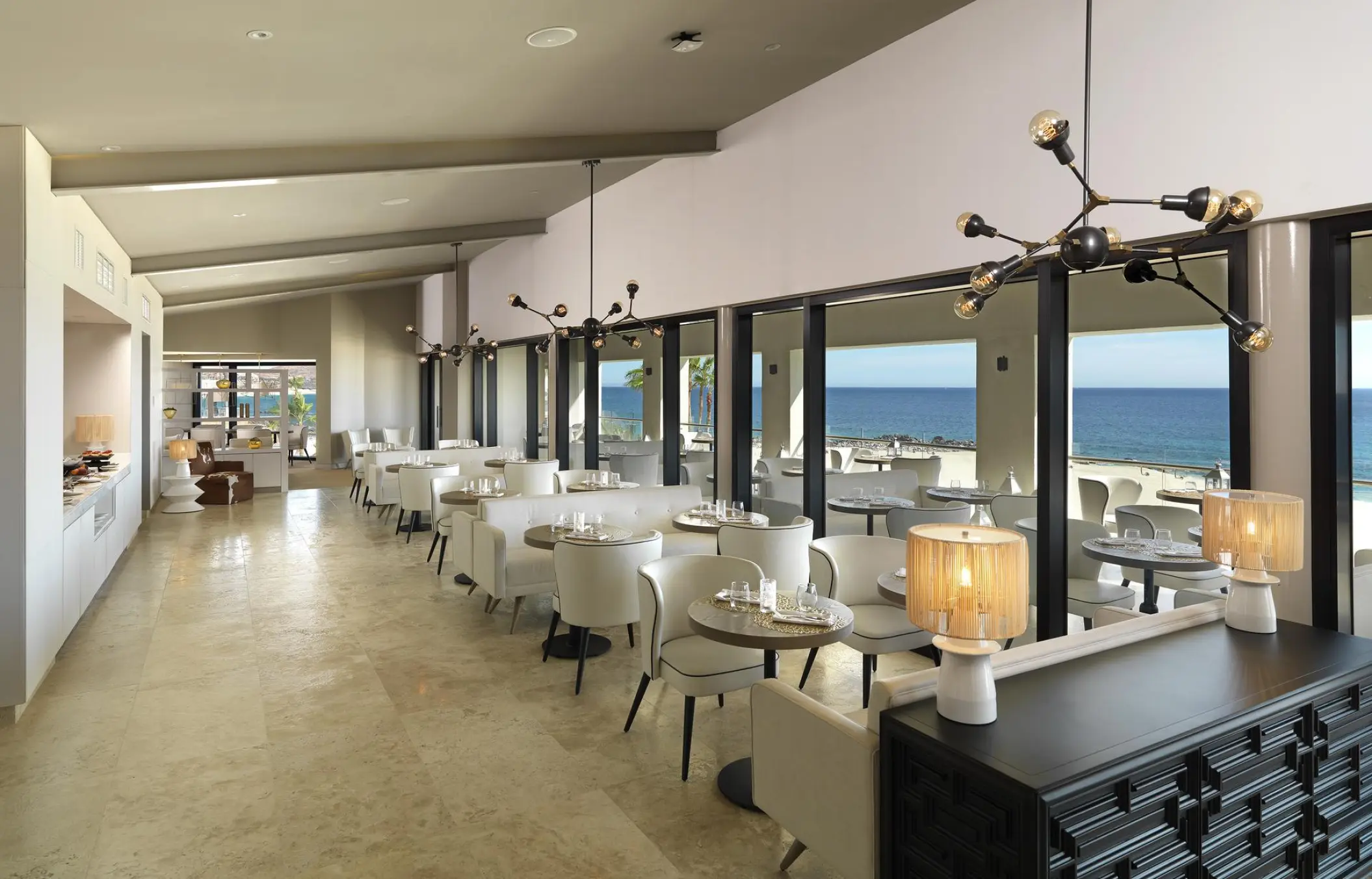 Modern restaurant dining room with ocean views at Paradisus Los Cabos, Cabo San Lucas