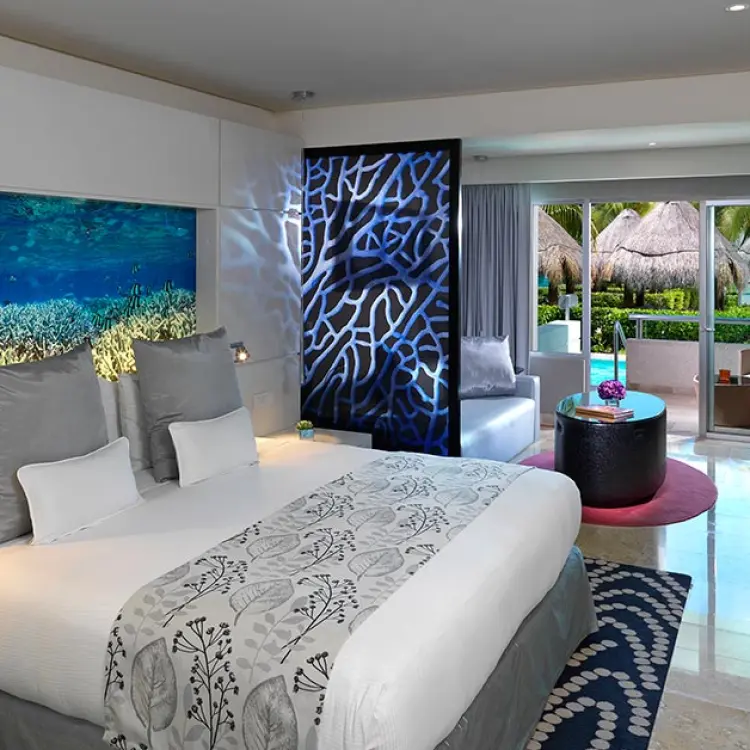 Luxury junior suite at Paradisus La Perla with modern decor and terrace access, Playa Del Carmen
