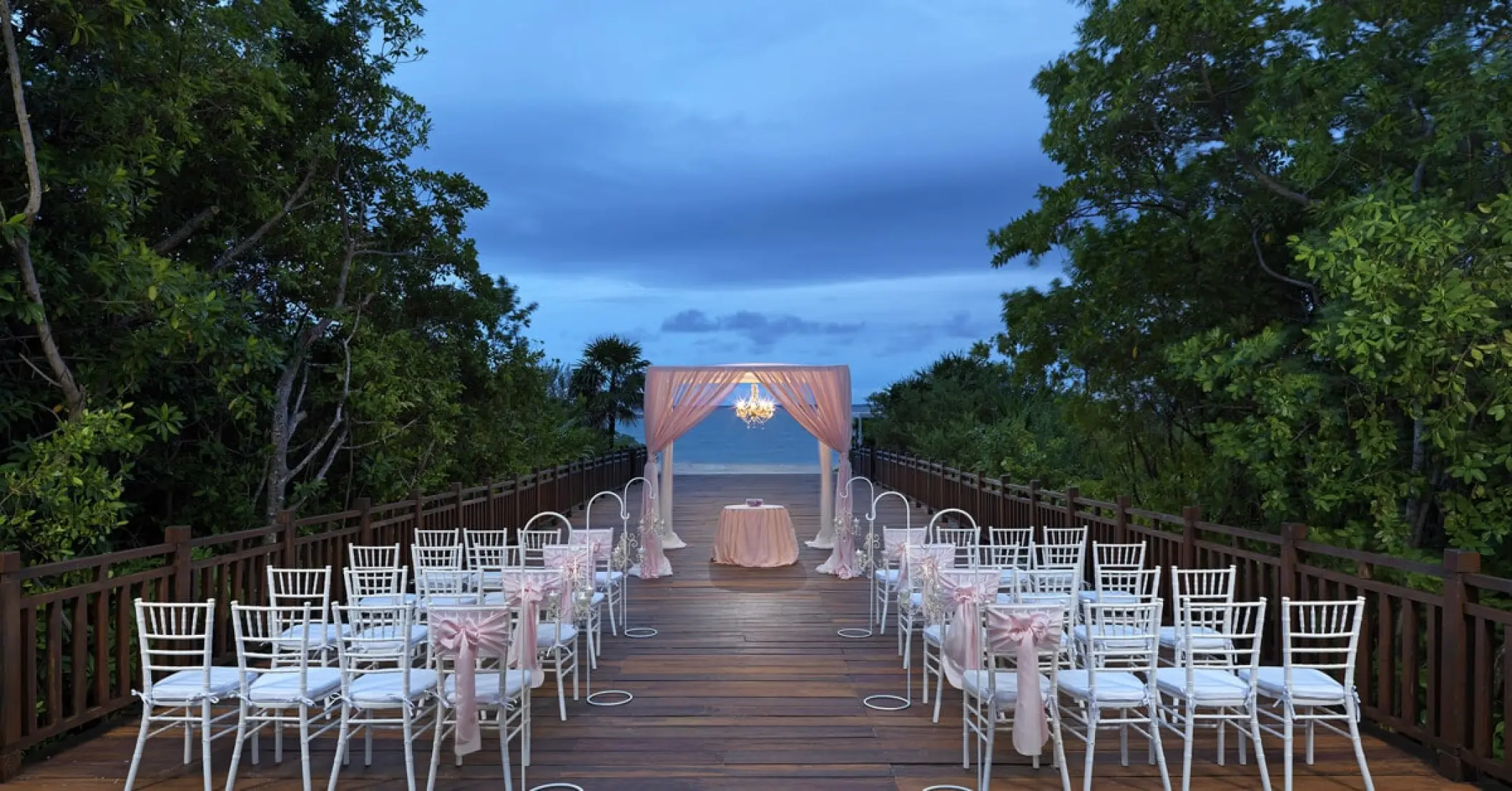 Wooden deck wedding ceremony at Paradisus La Perla, Playa Del Carmen
