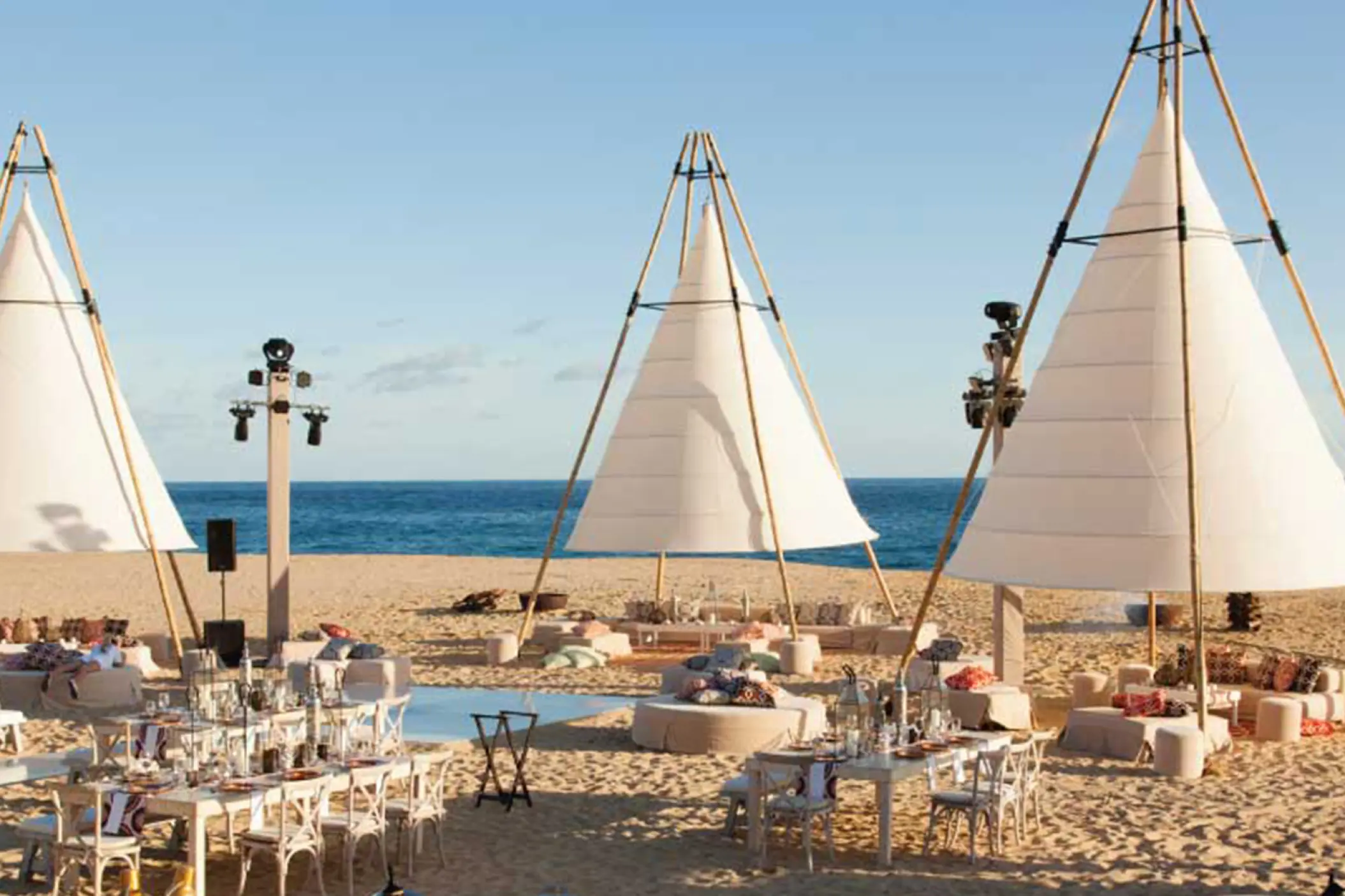 Beachfront wedding reception with teepee tents at Pueblo Bonito Pacifica, Cabo San Lucas