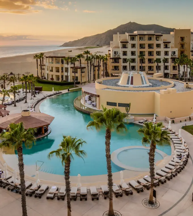 Aerial view of the pools and beachfront at Pueblo Bonito Pacifica at sunset, Cabo San Lucas