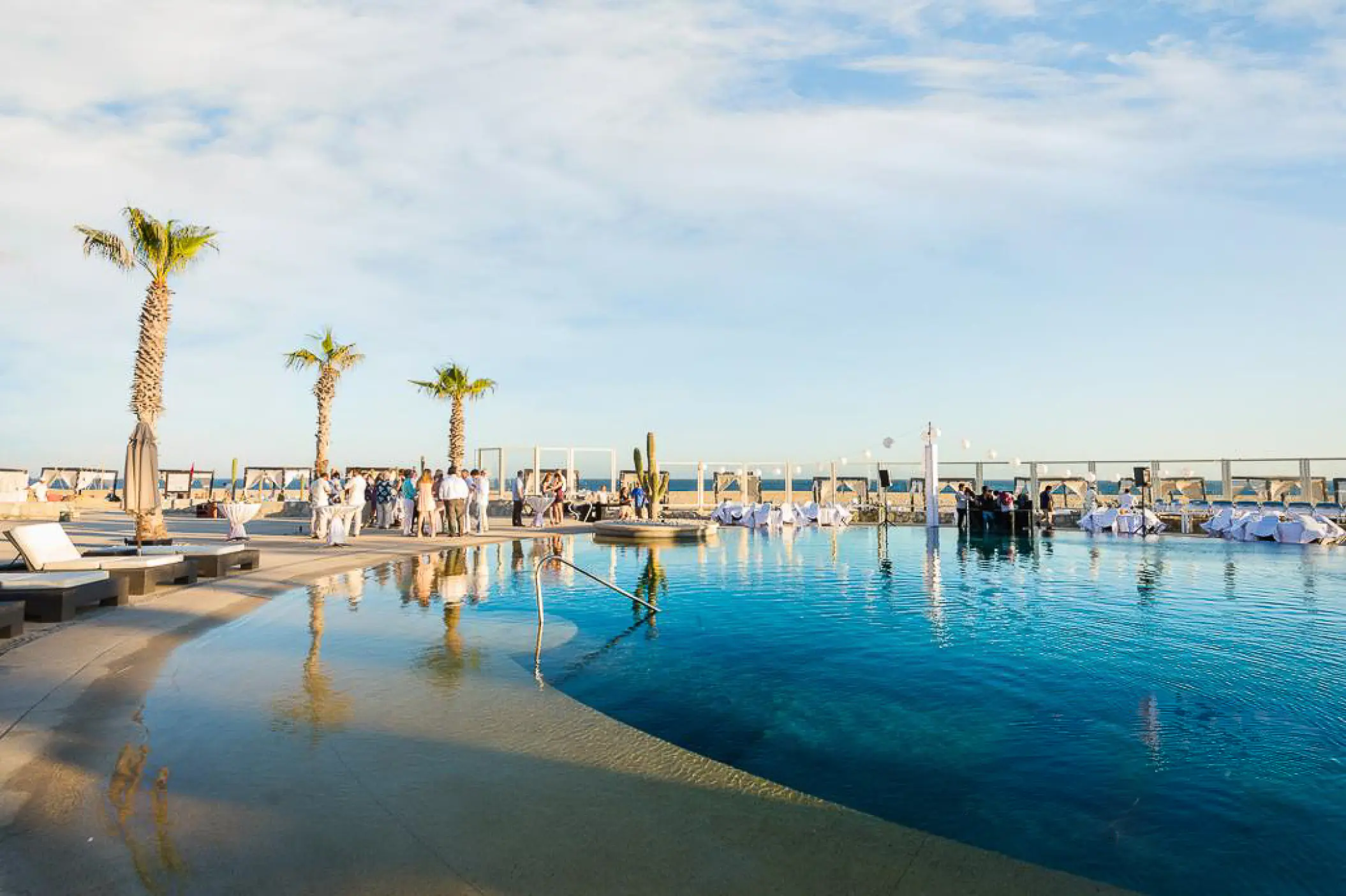 Outdoor wedding reception by the Constellation pool deck at Pueblo Bonito Pacifica, Cabo San Lucas