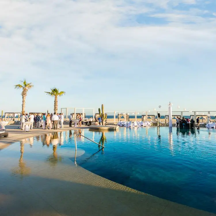 Outdoor wedding reception by the Constellation pool deck at Pueblo Bonito Pacifica, Cabo San Lucas