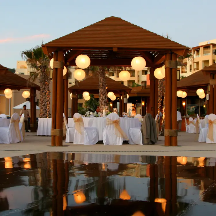 Evening wedding reception under lit gazebos at Pueblo Bonito Pacifica, Cabo San Lucas