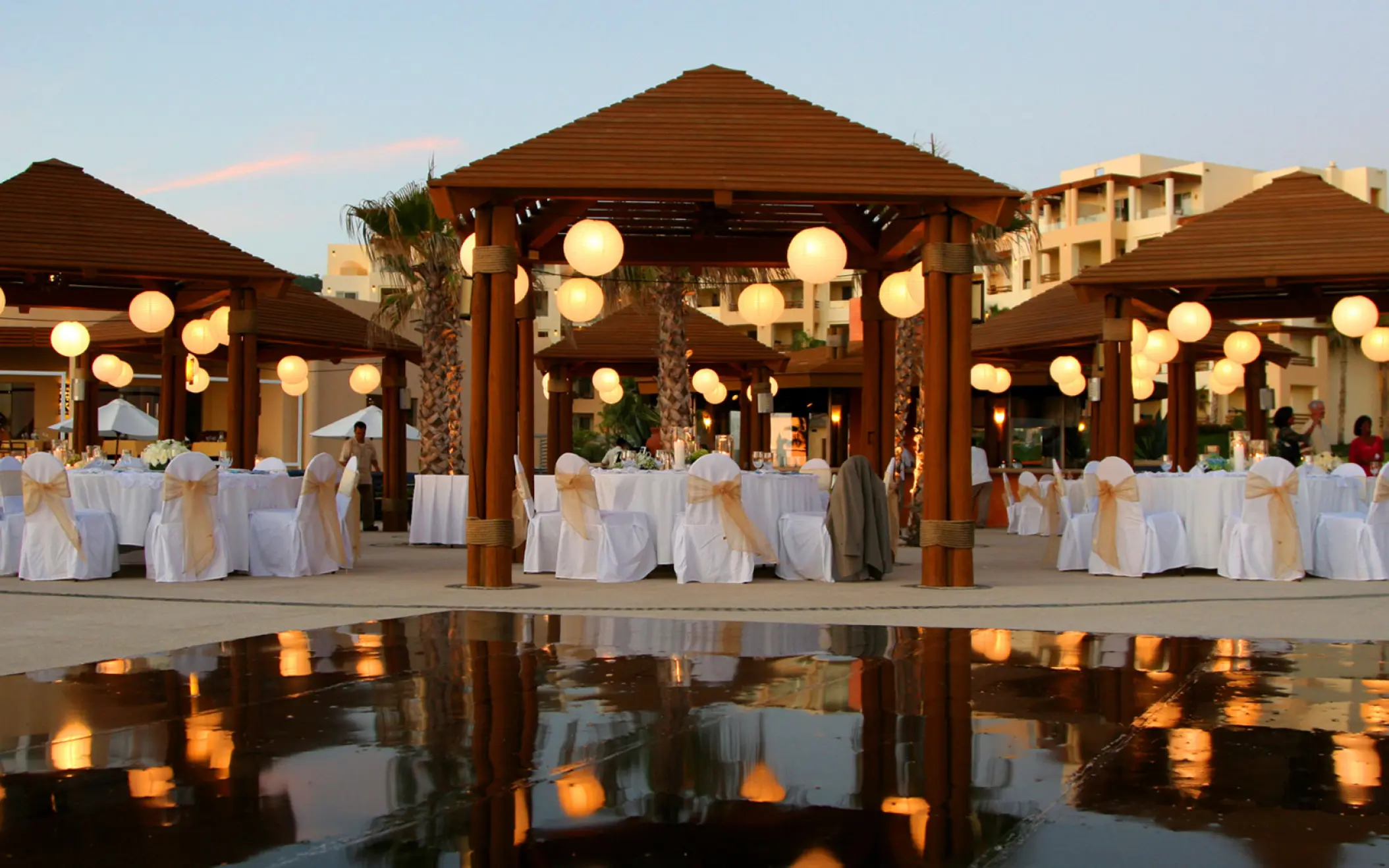 Evening wedding reception under lit gazebos at Pueblo Bonito Pacifica, Cabo San Lucas