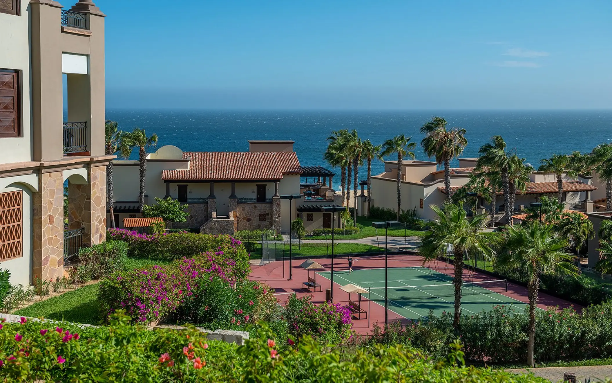 Tennis courts and oceanfront suites at Pueblo Bonito Sunset Beach, Cabo San Lucas