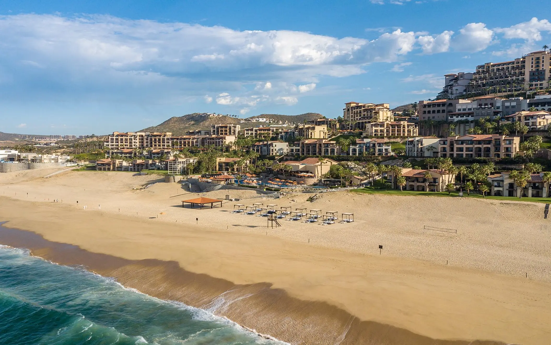 Aerial view of Pueblo Bonito Sunset Beach buildings on the hillside overlooking the beach, Cabo San Lucas