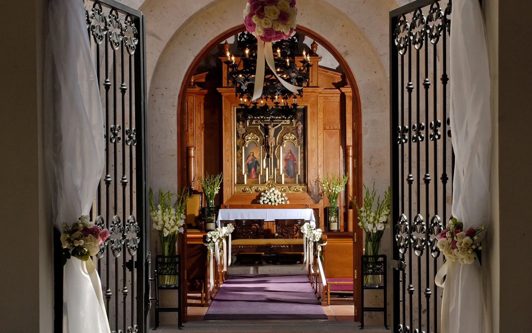 Chapel wedding ceremony venue with floral decor at Pueblo Bonito Sunset Beach, Cabo San Lucas