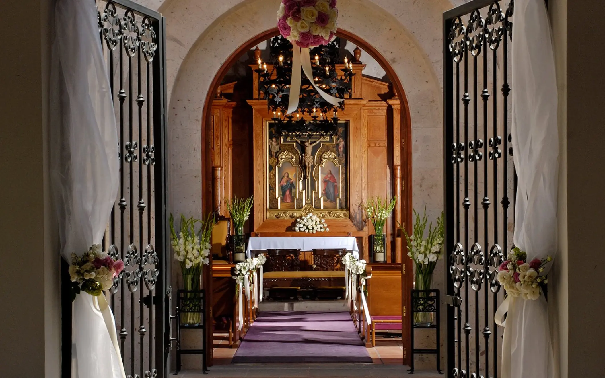 Chapel wedding ceremony venue with floral decor at Pueblo Bonito Sunset Beach, Cabo San Lucas