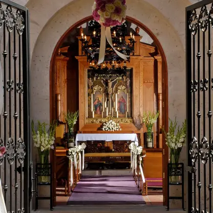 Chapel wedding ceremony venue with floral decor at Pueblo Bonito Sunset Beach, Cabo San Lucas