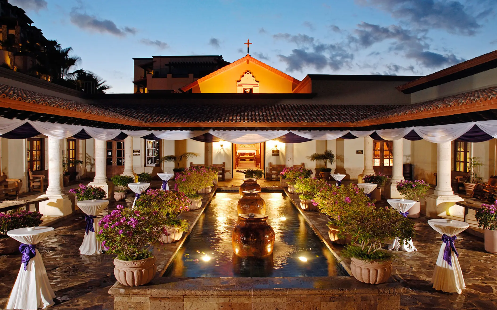 Courtyard wedding reception setup by the chapel at Pueblo Bonito Sunset Beach, Cabo San Lucas