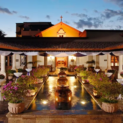 Courtyard wedding reception setup by the chapel at Pueblo Bonito Sunset Beach, Cabo San Lucas