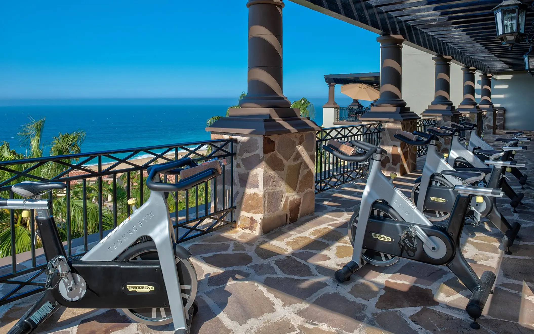 Outdoor fitness terrace with stationary bikes at Pueblo Bonito Sunset Beach, Cabo San Lucas