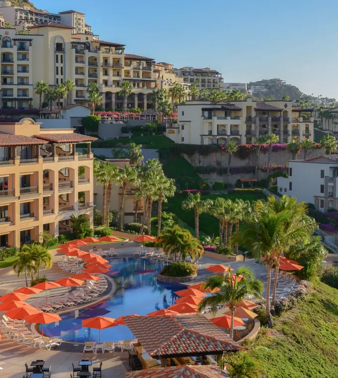 Pueblo Bonito Sunset Beach tiered pool area and orange umbrellas, Cabo San Lucas