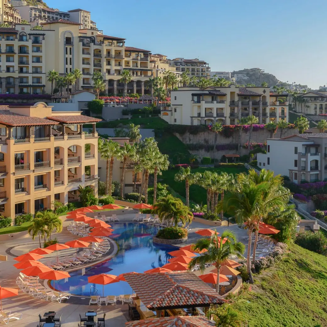 Pueblo Bonito Sunset Beach tiered pool area and orange umbrellas, Cabo San Lucas