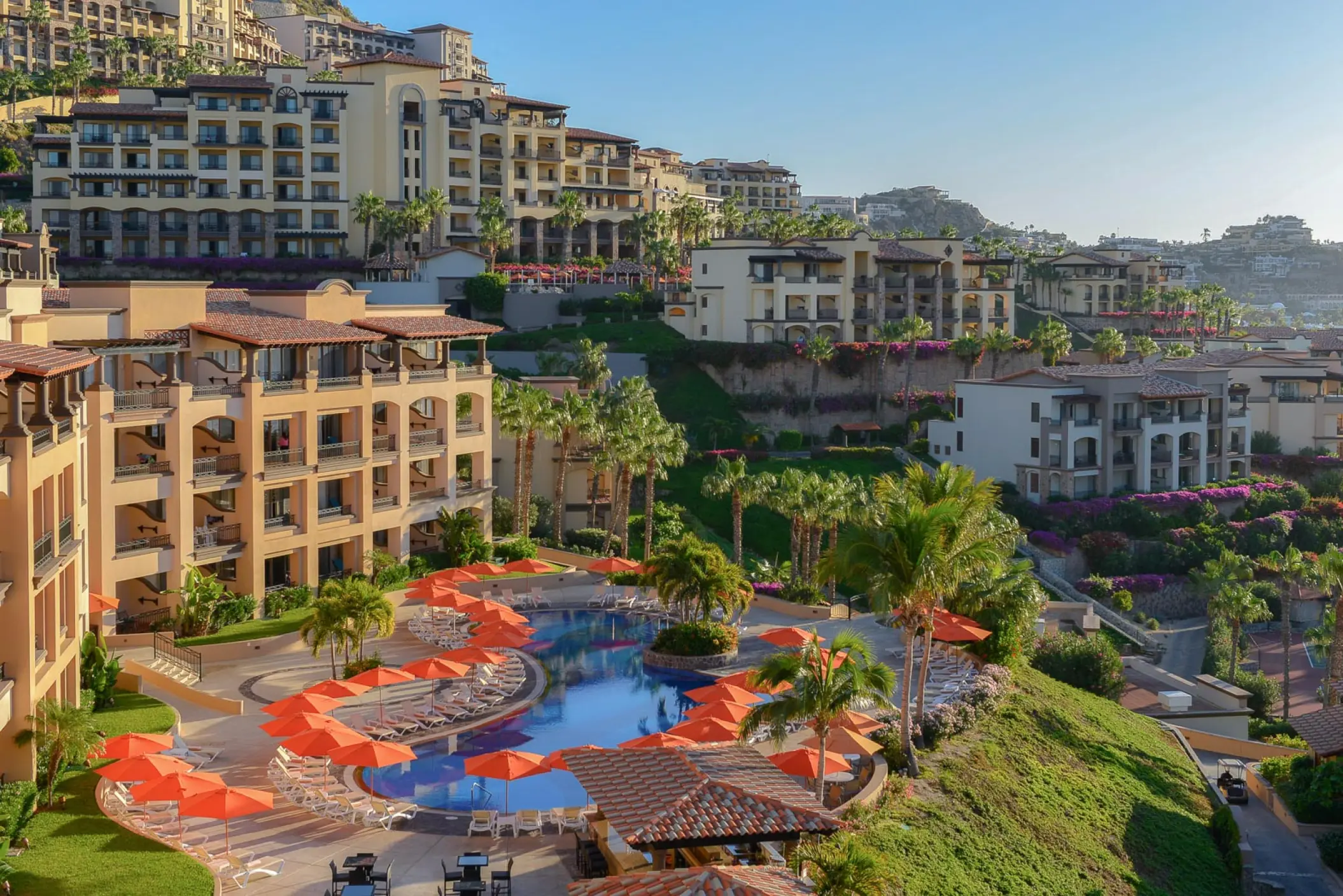 Pueblo Bonito Sunset Beach tiered pool area and orange umbrellas, Cabo San Lucas