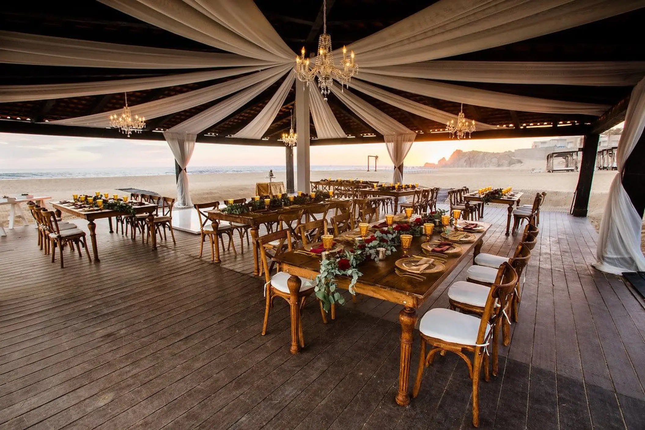 Covered beachfront wedding reception with white ceiling drapes at Pueblo Bonito Sunset Beach, Cabo San Lucas