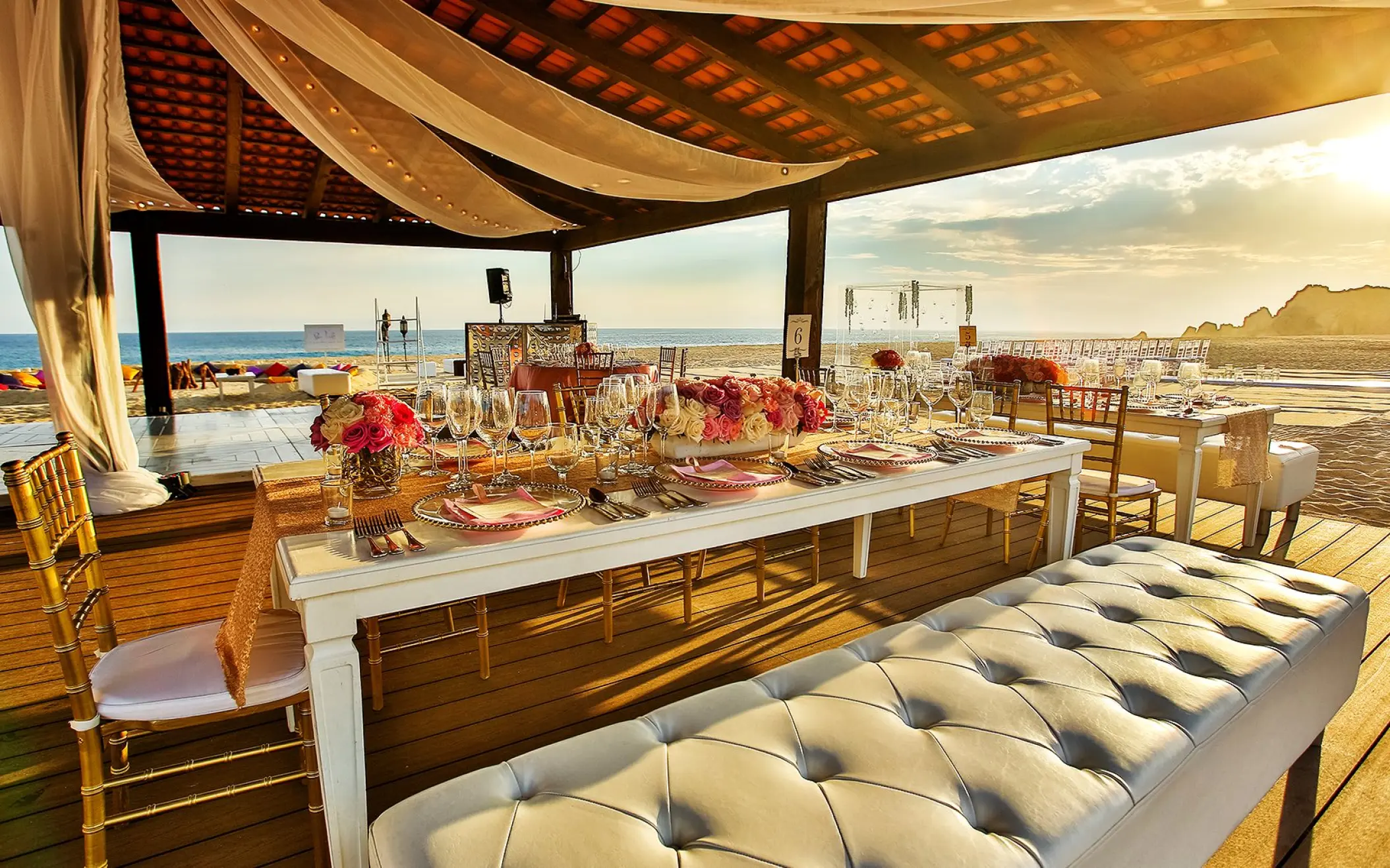 Ocean Breeze Deck wedding reception with floral centerpieces at Pueblo Bonito Sunset Beach, Cabo San Lucas