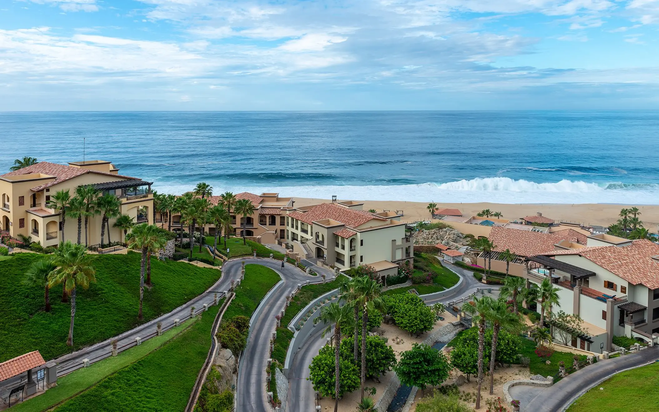 Aerial view of Pueblo Bonito Sunset Beach suites and grounds along the coastline, Cabo San Lucas