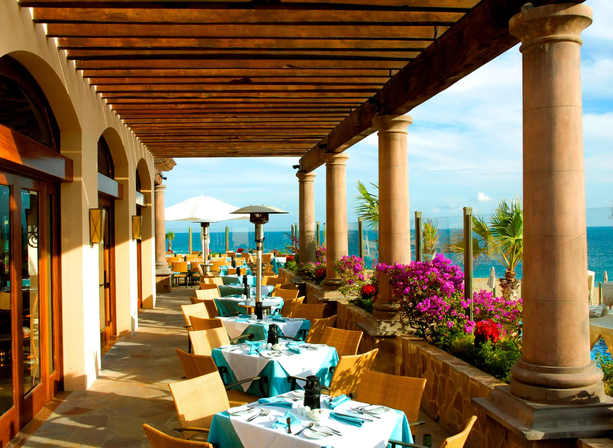 Outdoor terrace restaurant with ocean views at Pueblo Bonito Sunset Beach, Cabo San Lucas