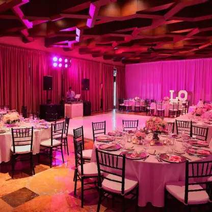Santa Ana Ballroom wedding reception with pink lighting and dance floor at Pueblo Bonito Sunset Beach, Cabo San Lucas