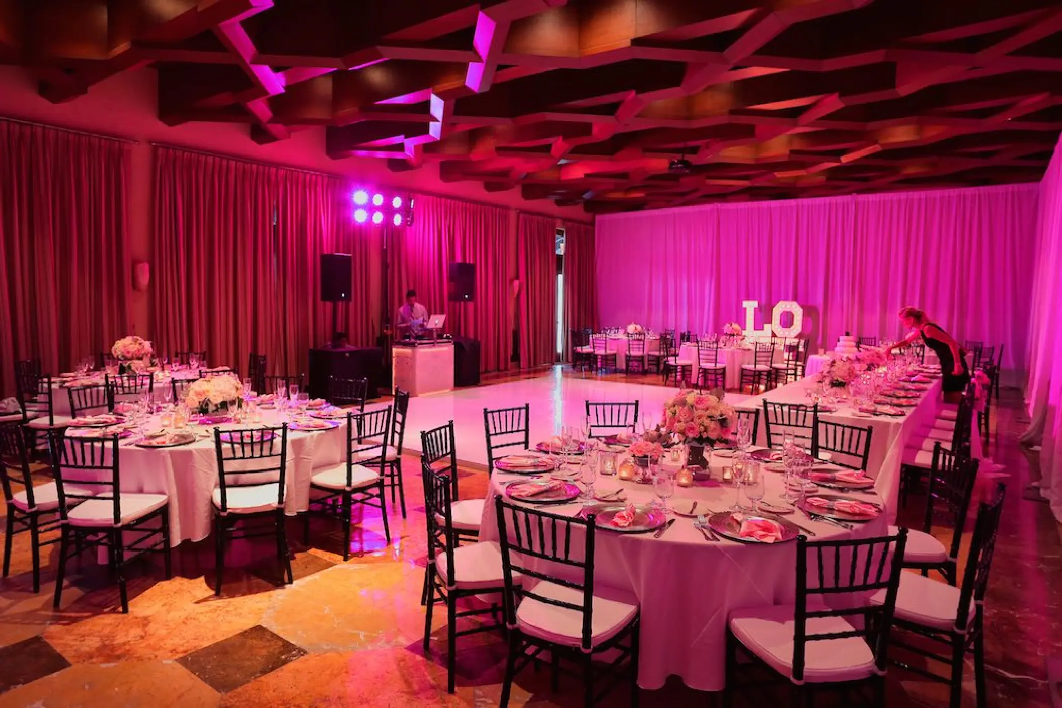 Santa Ana Ballroom wedding reception with pink lighting and dance floor at Pueblo Bonito Sunset Beach, Cabo San Lucas