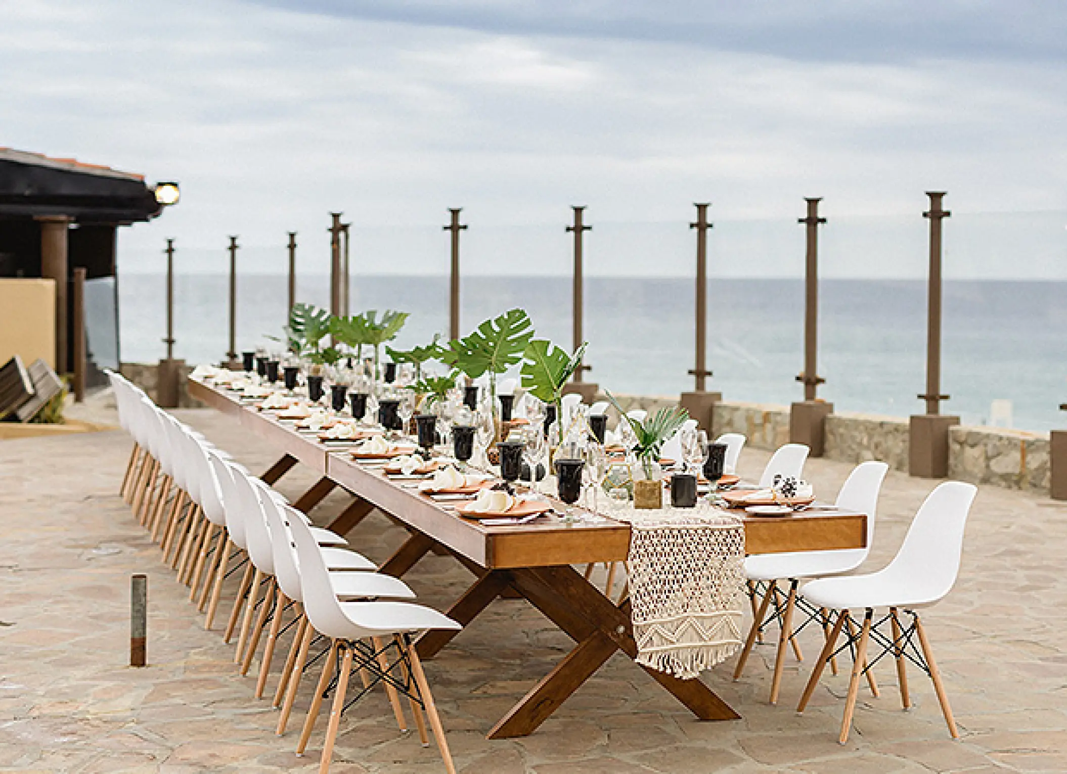 Outdoor wedding reception table with ocean views at Pueblo Bonito Sunset Beach, Cabo San Lucas