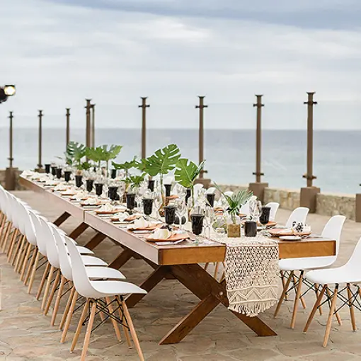 Outdoor wedding reception table with ocean views at Pueblo Bonito Sunset Beach, Cabo San Lucas