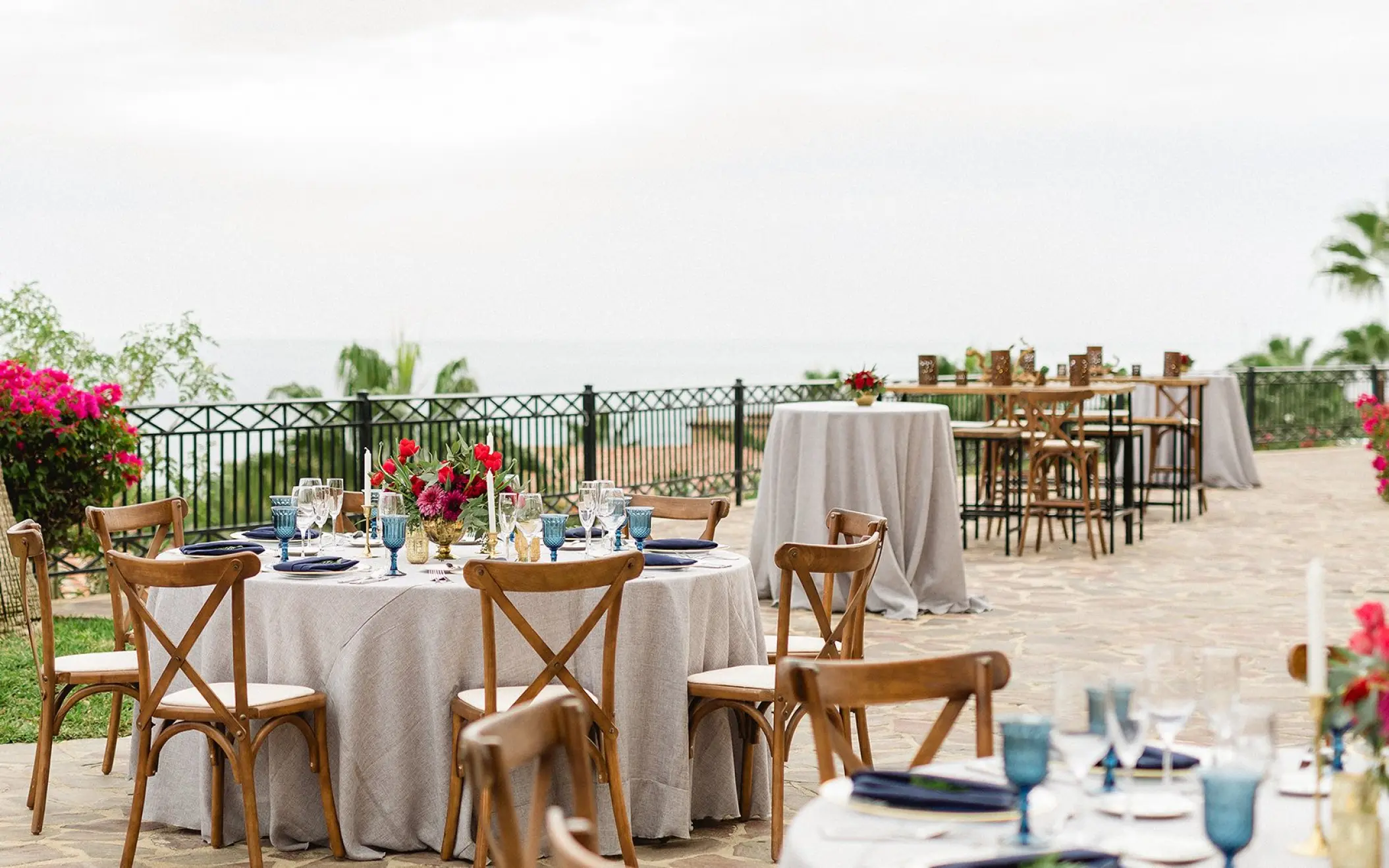 Terrace wedding reception with cross-back chairs at Pueblo Bonito Sunset Beach, Cabo San Lucas