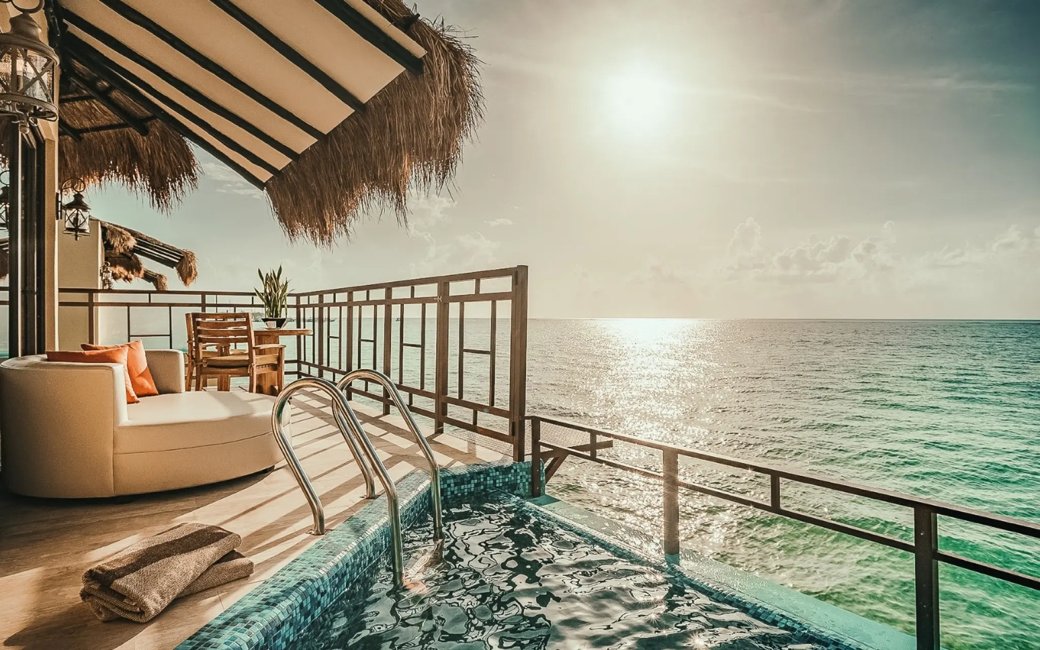 Private terrace with a plunge pool overlooking the ocean at a destination wedding resort