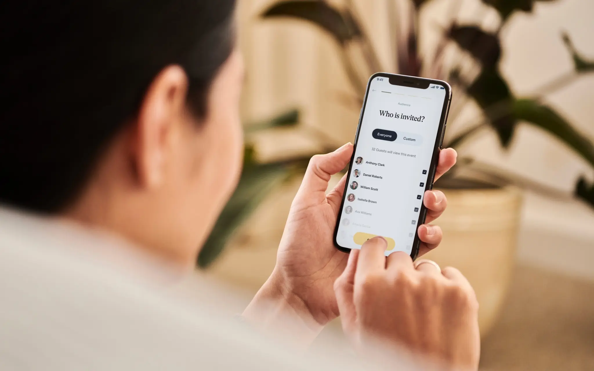 Close-up of a person using a mobile app on their smartphone