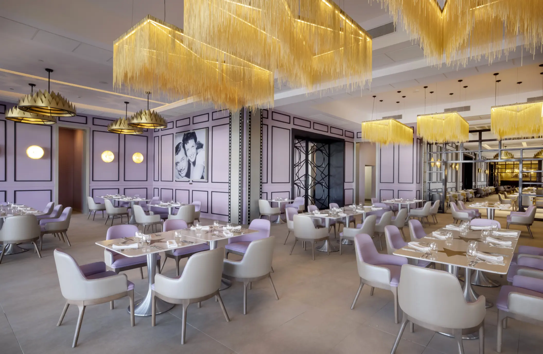 SoCal Gourmet Food Emporium dining room with purple walls and gold chandeliers at Planet Hollywood Cancun, Cancun