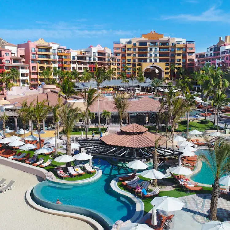Playa Grande Resort exterior and swimming pools with white umbrellas, Cabo San Lucas