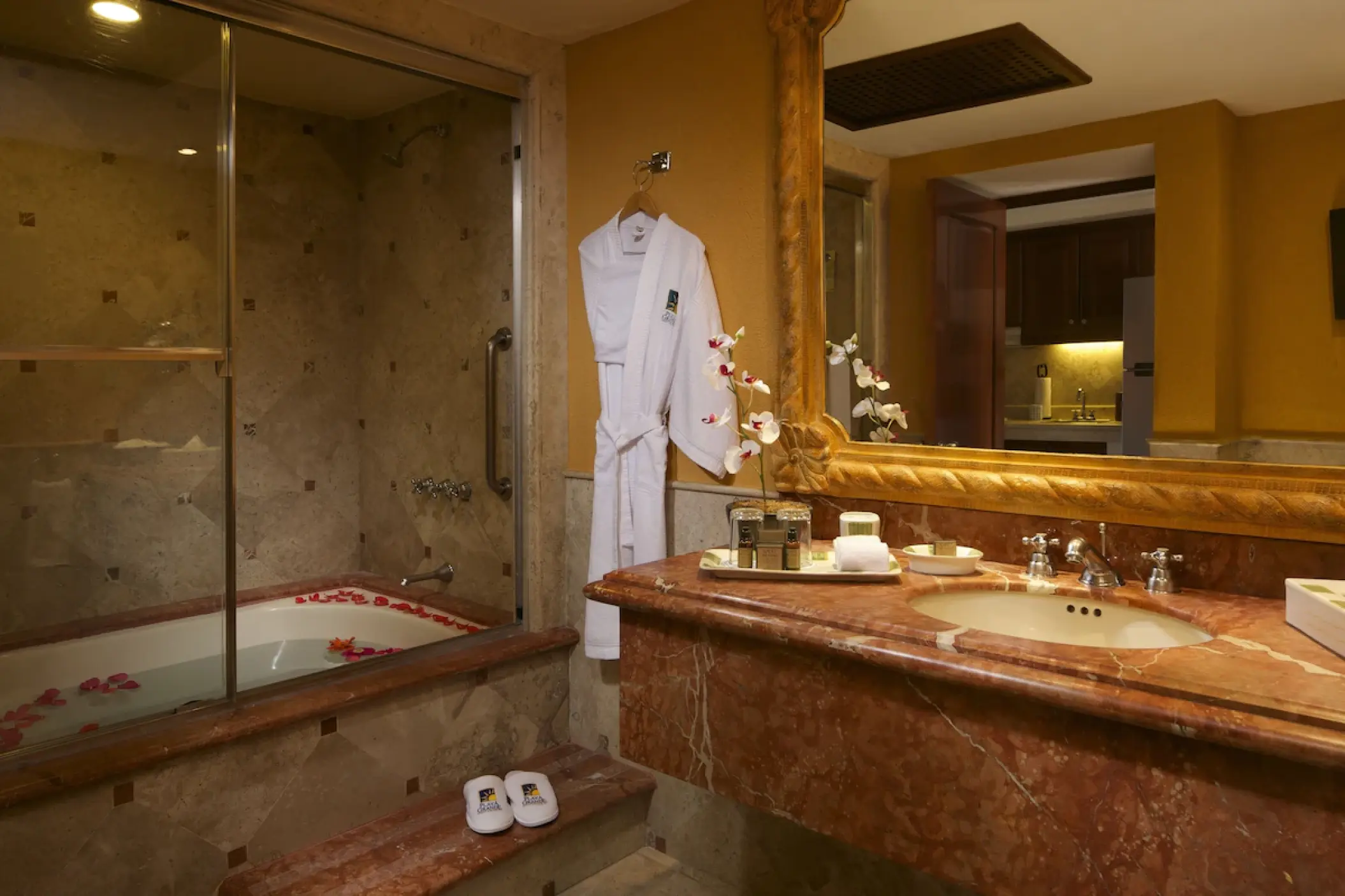Playa Grande Resort suite bathroom with marble vanity and soaking tub, Cabo San Lucas