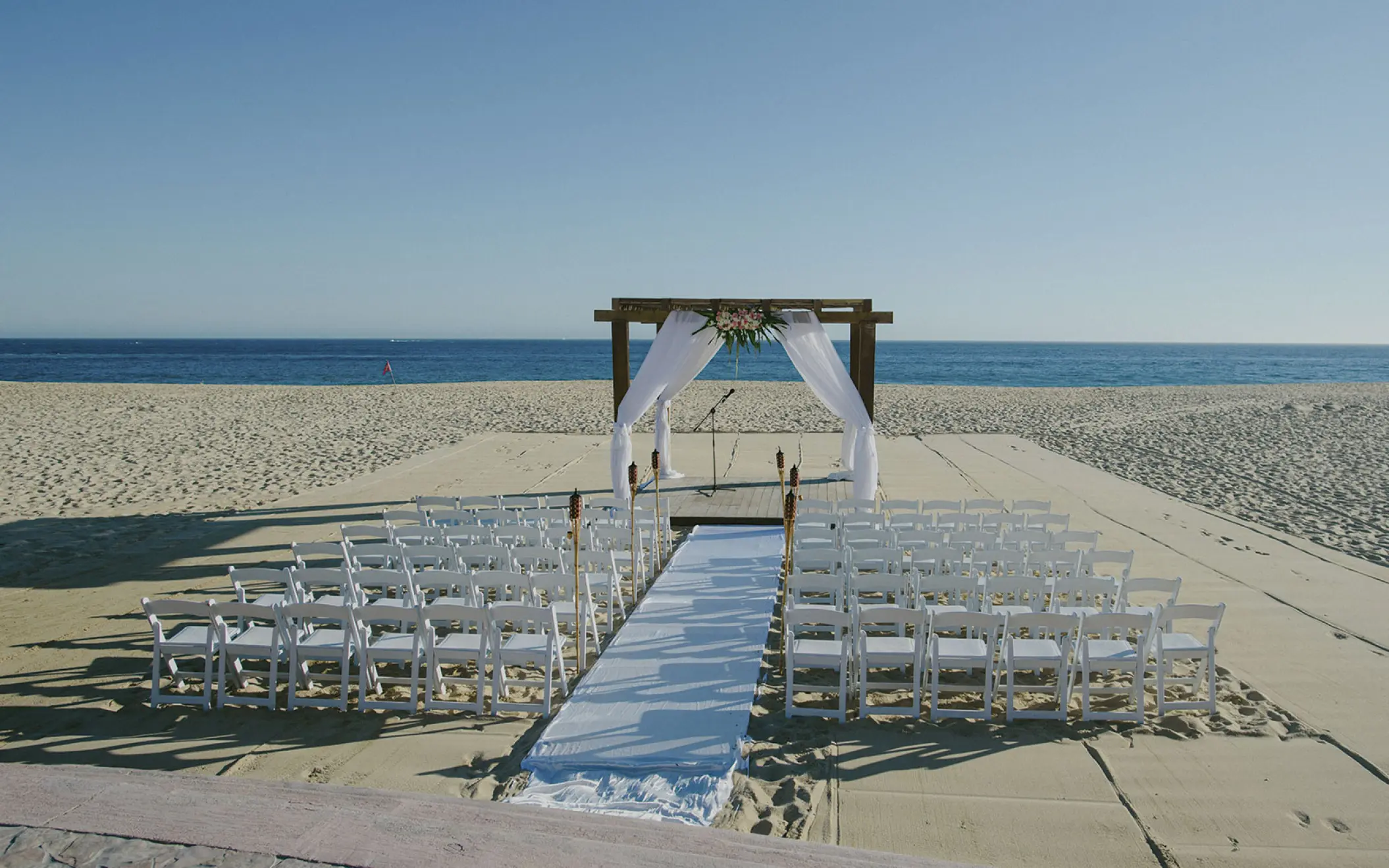 Beachfront wedding ceremony setup at Playa Grande Resort, Cabo San Lucas