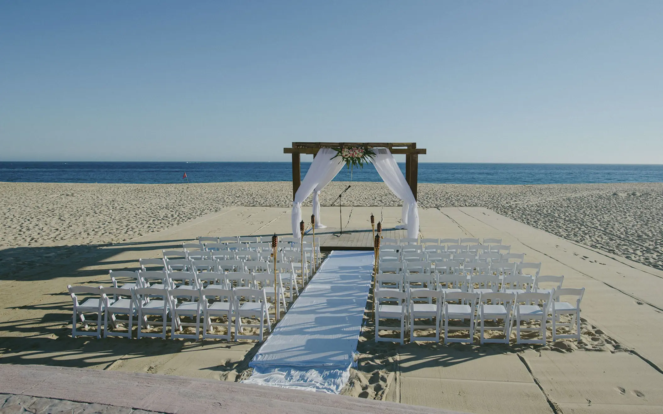 Beachfront wedding ceremony setup at Playa Grande Resort, Cabo San Lucas
