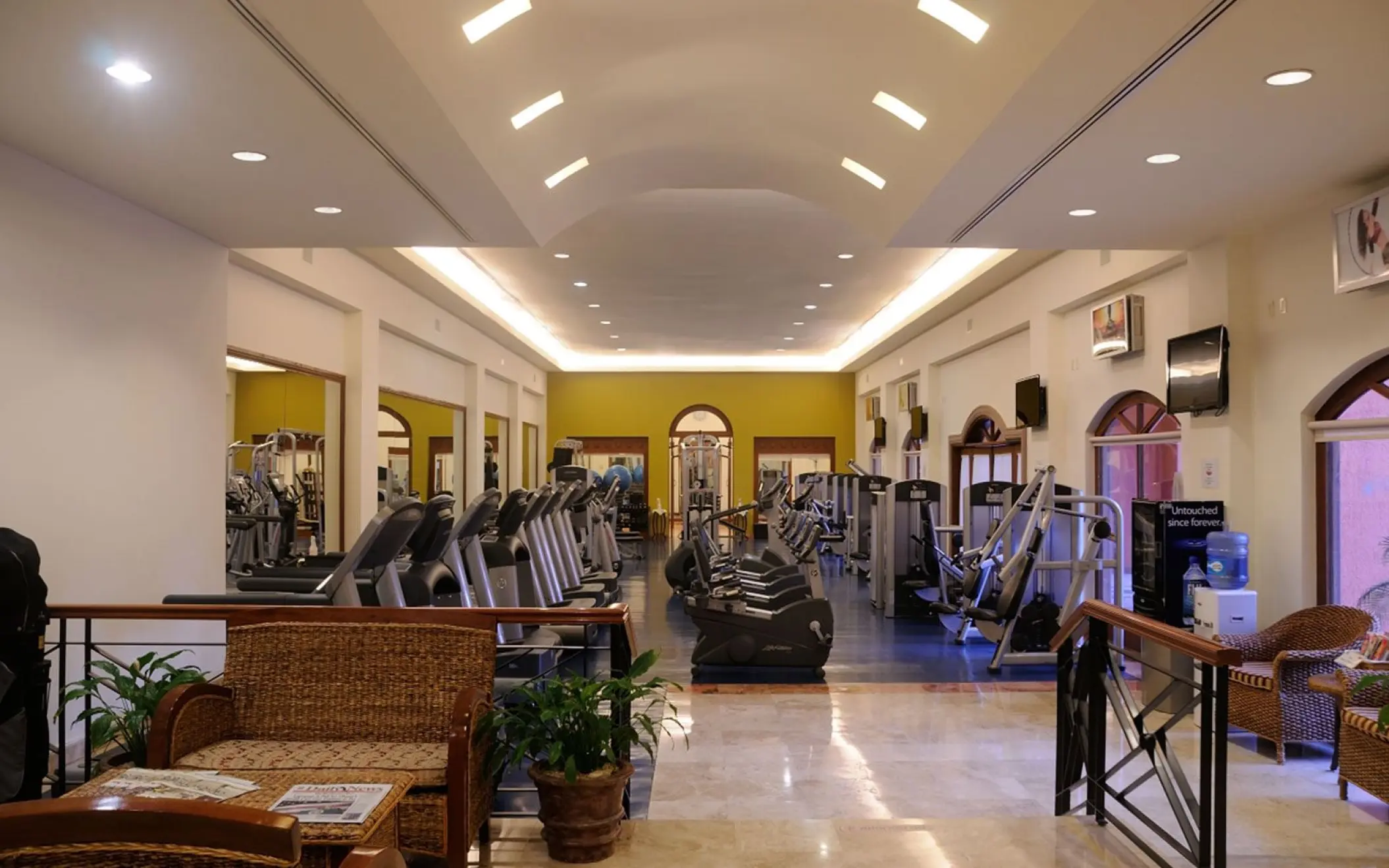 Resort fitness center with cardio and weight machines at Playa Grande Resort, Cabo San Lucas