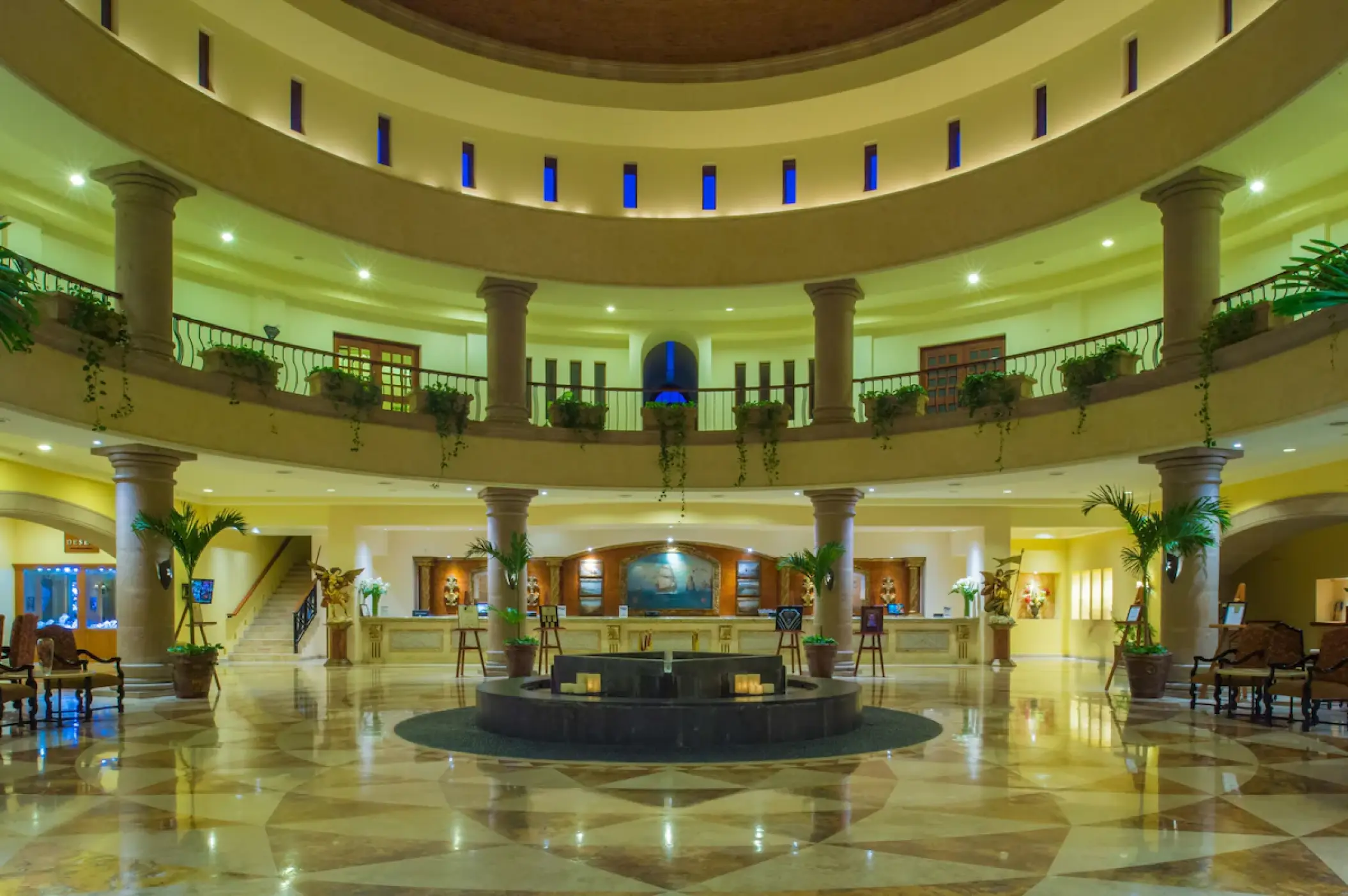 Playa Grande Resort multi-story lobby with columns and a central fountain, Cabo San Lucas