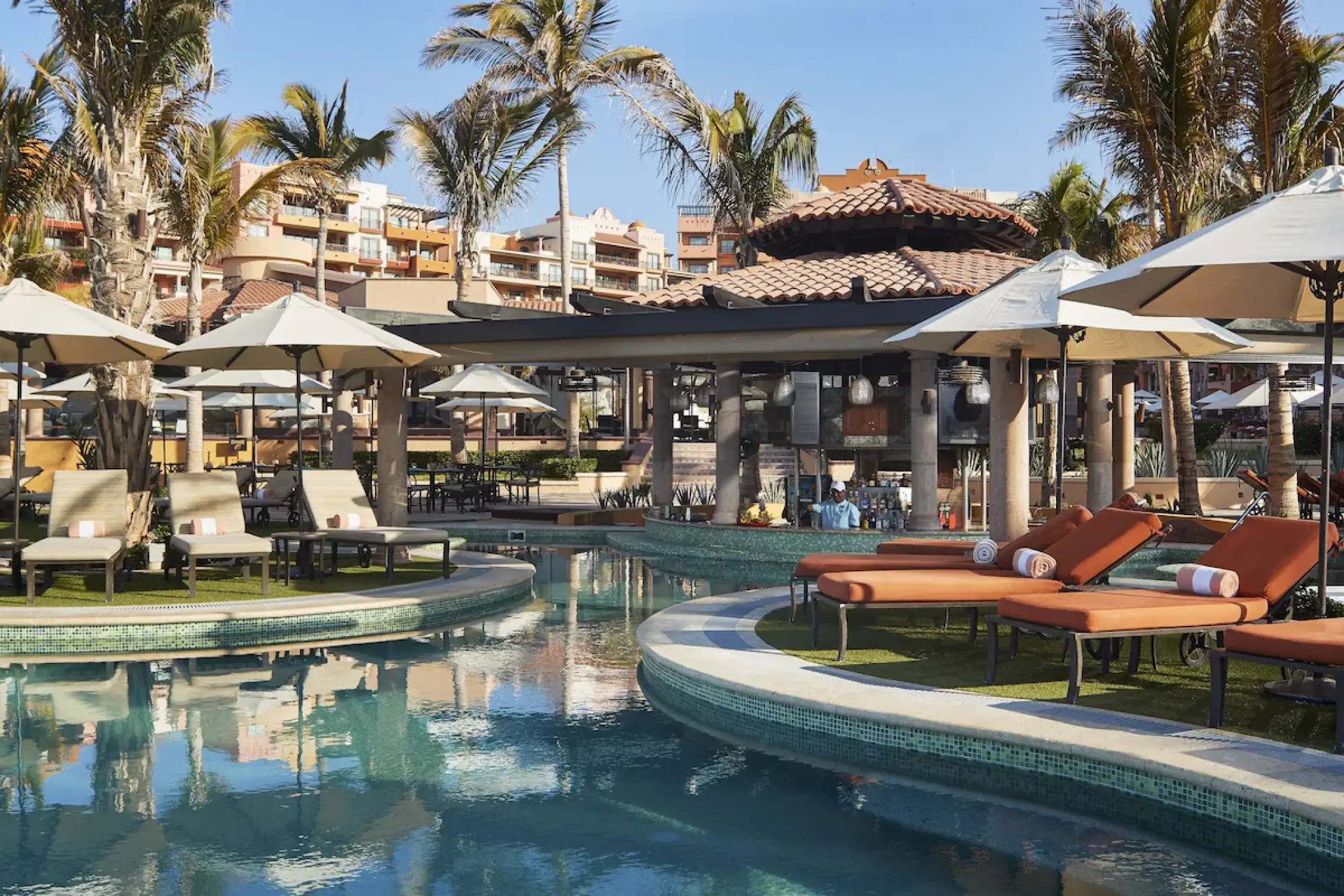 Playa Grande Resort swim-up bar and poolside lounge chairs, Cabo San Lucas