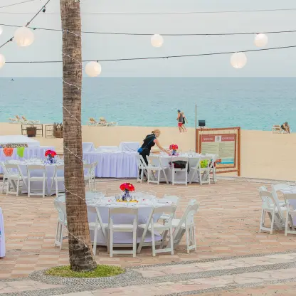 Terrace wedding reception with paper lanterns and ocean views at Playa Grande Resort, Cabo San Lucas