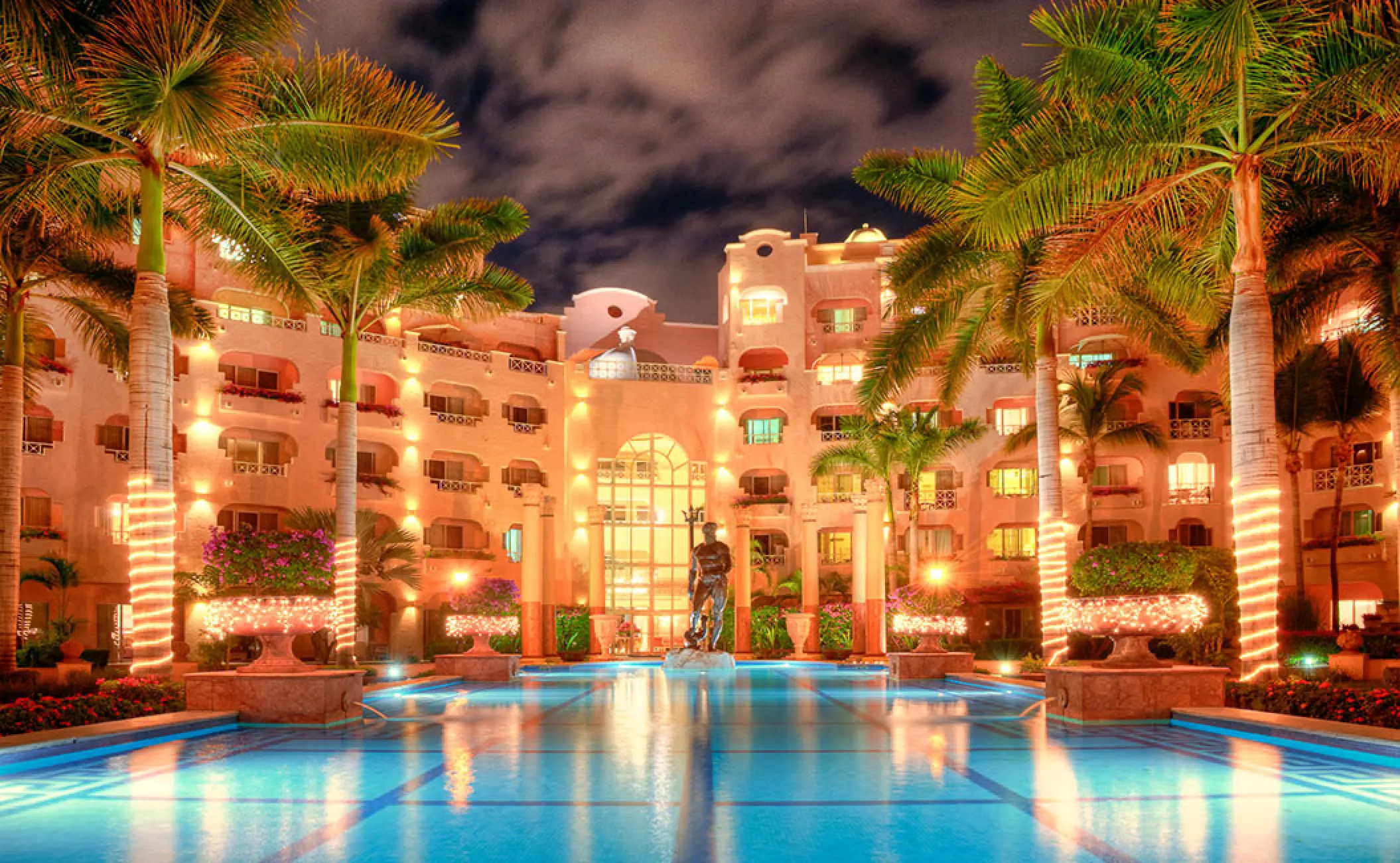 Pueblo Bonito Rose courtyard and pool illuminated at night, Cabo San Lucas