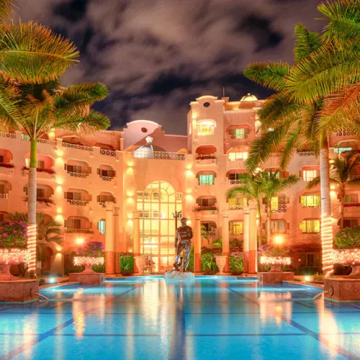 Pueblo Bonito Rose courtyard and pool illuminated at night, Cabo San Lucas
