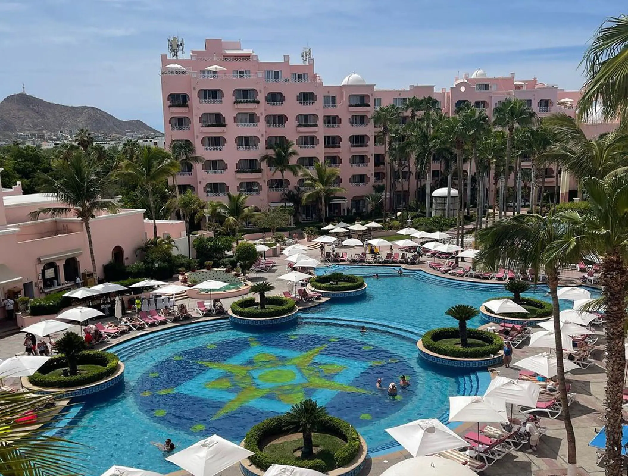 Mosaic tiled pool and pink resort buildings at Pueblo Bonito Rose, Cabo San Lucas