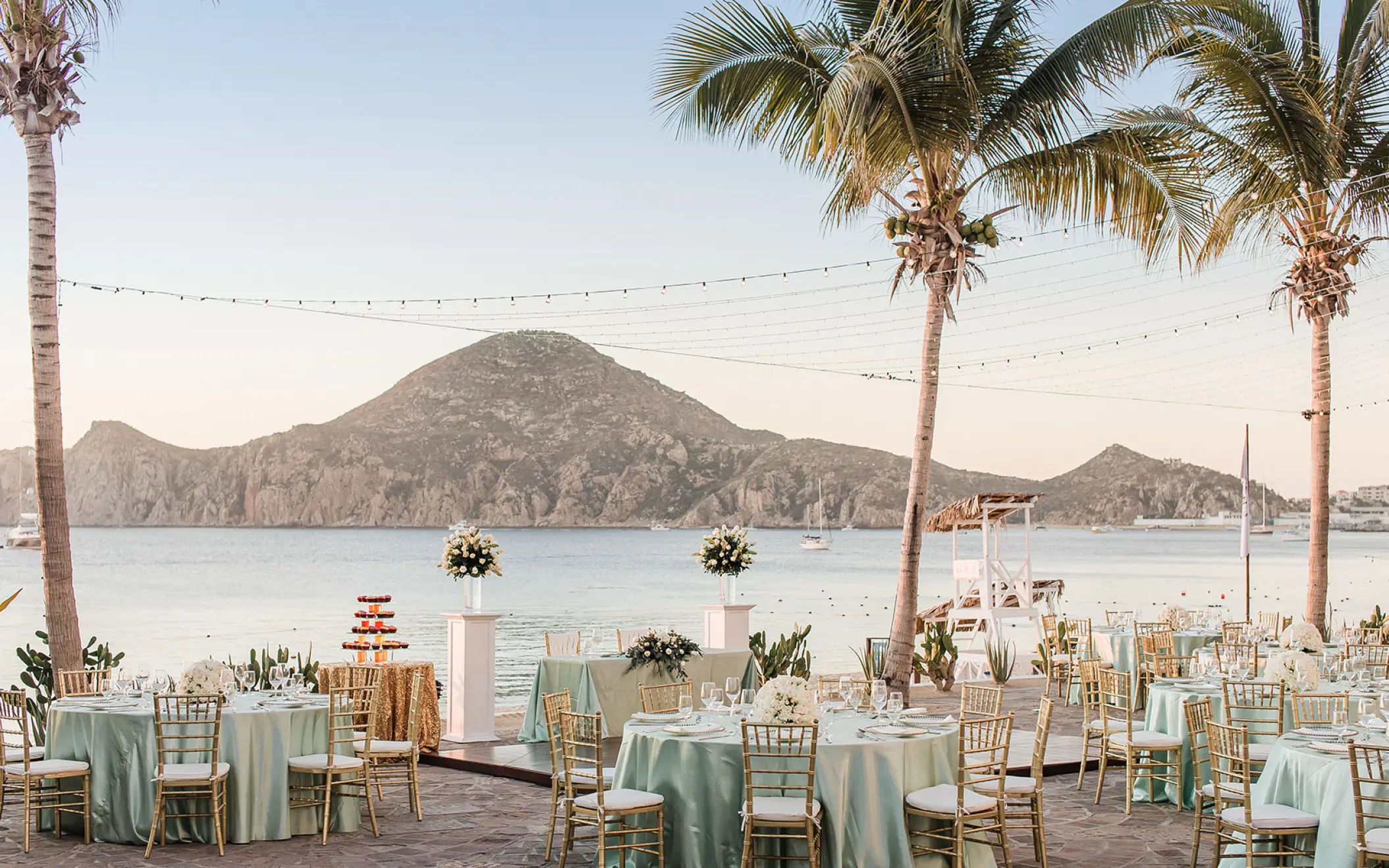 Outdoor wedding reception with mint green linens at Pueblo Bonito Los Cabos, Cabo San Lucas