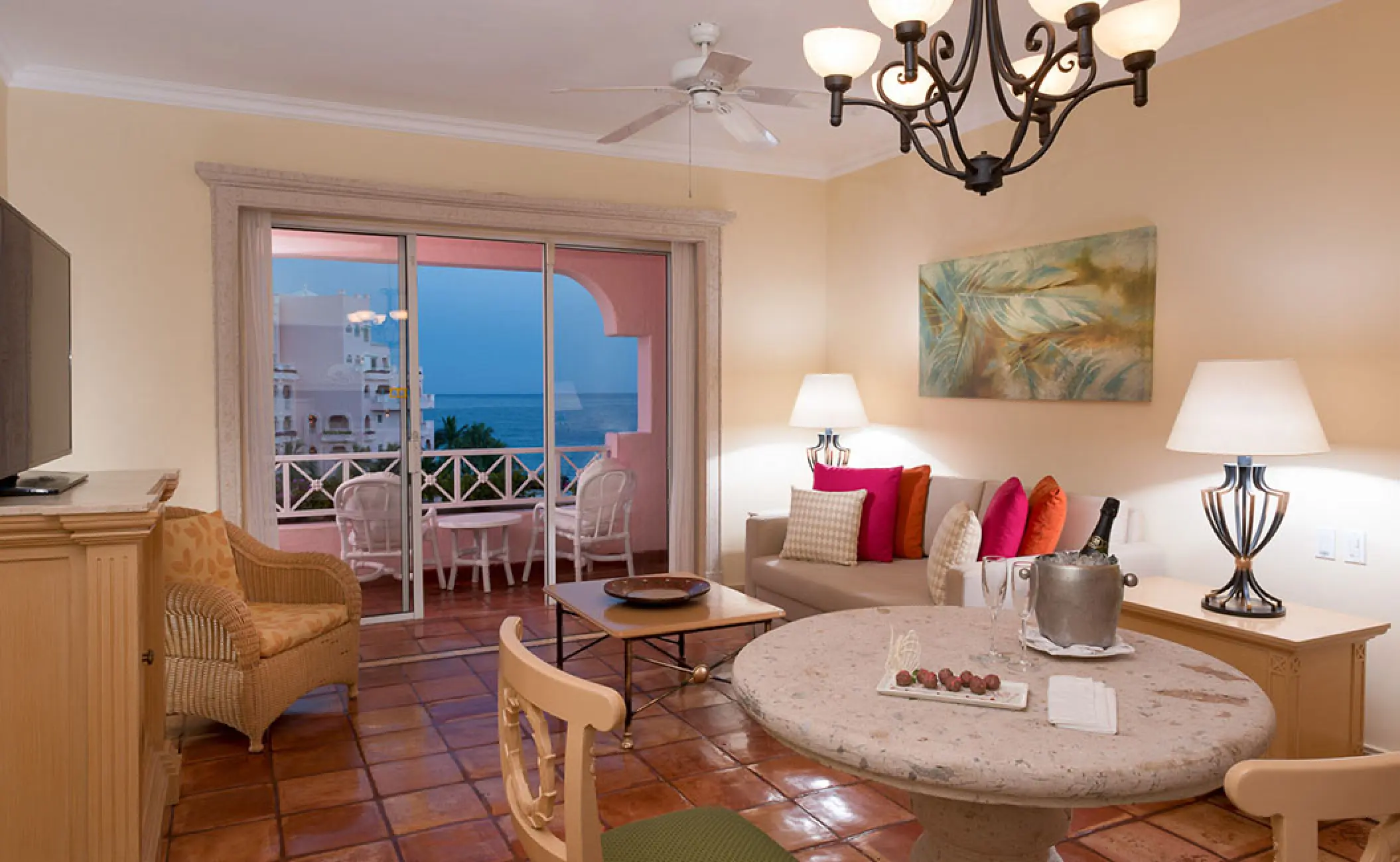 Suite living area with a balcony overlooking the ocean at Pueblo Bonito Rose, Cabo San Lucas
