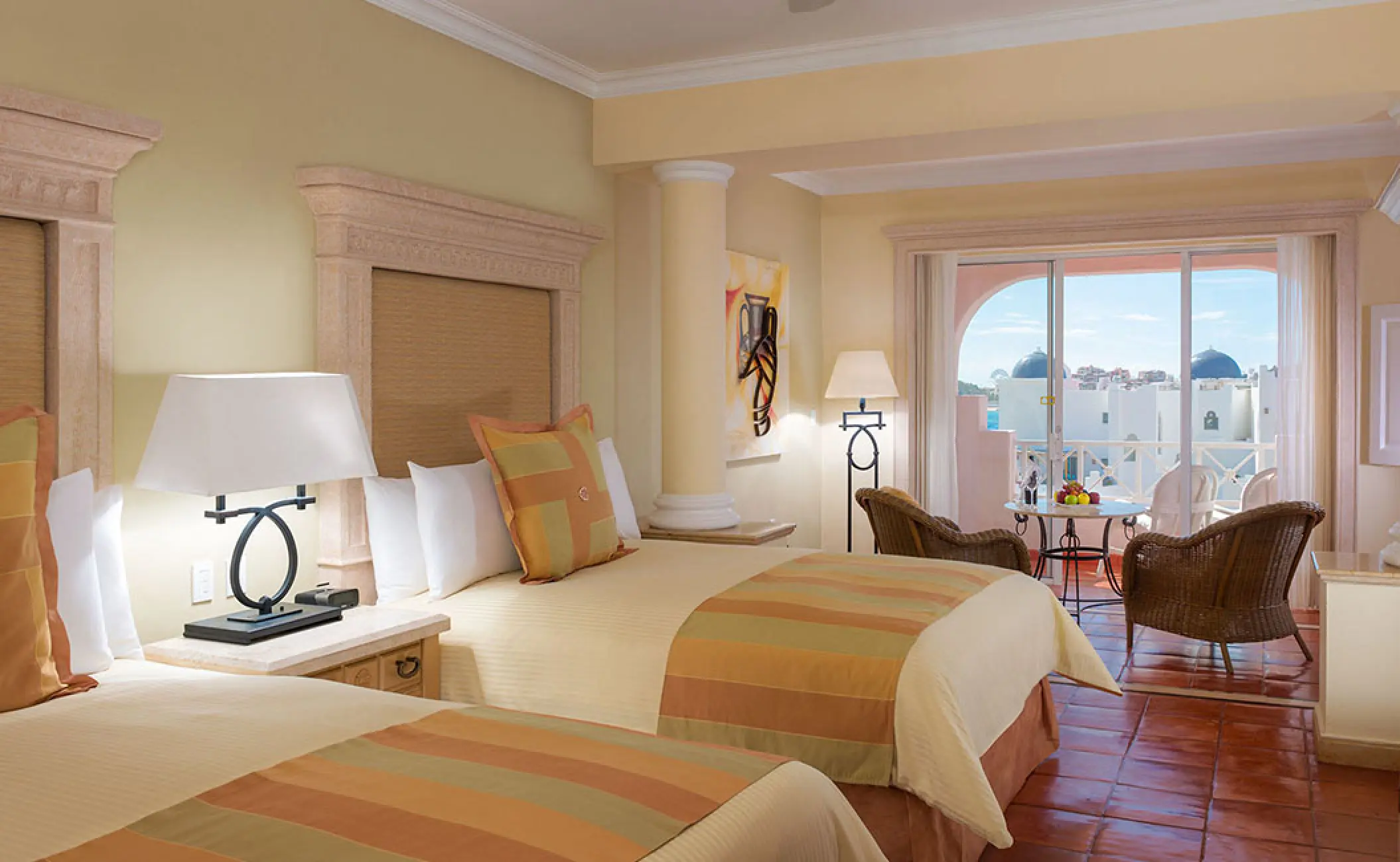 Guest suite with two double beds and a private balcony at Pueblo Bonito Rose, Cabo San Lucas