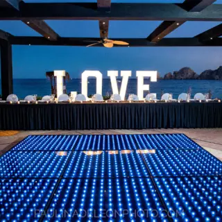 Illuminated dance floor and LOVE sign for a reception at Pueblo Bonito Rose, Cabo San Lucas