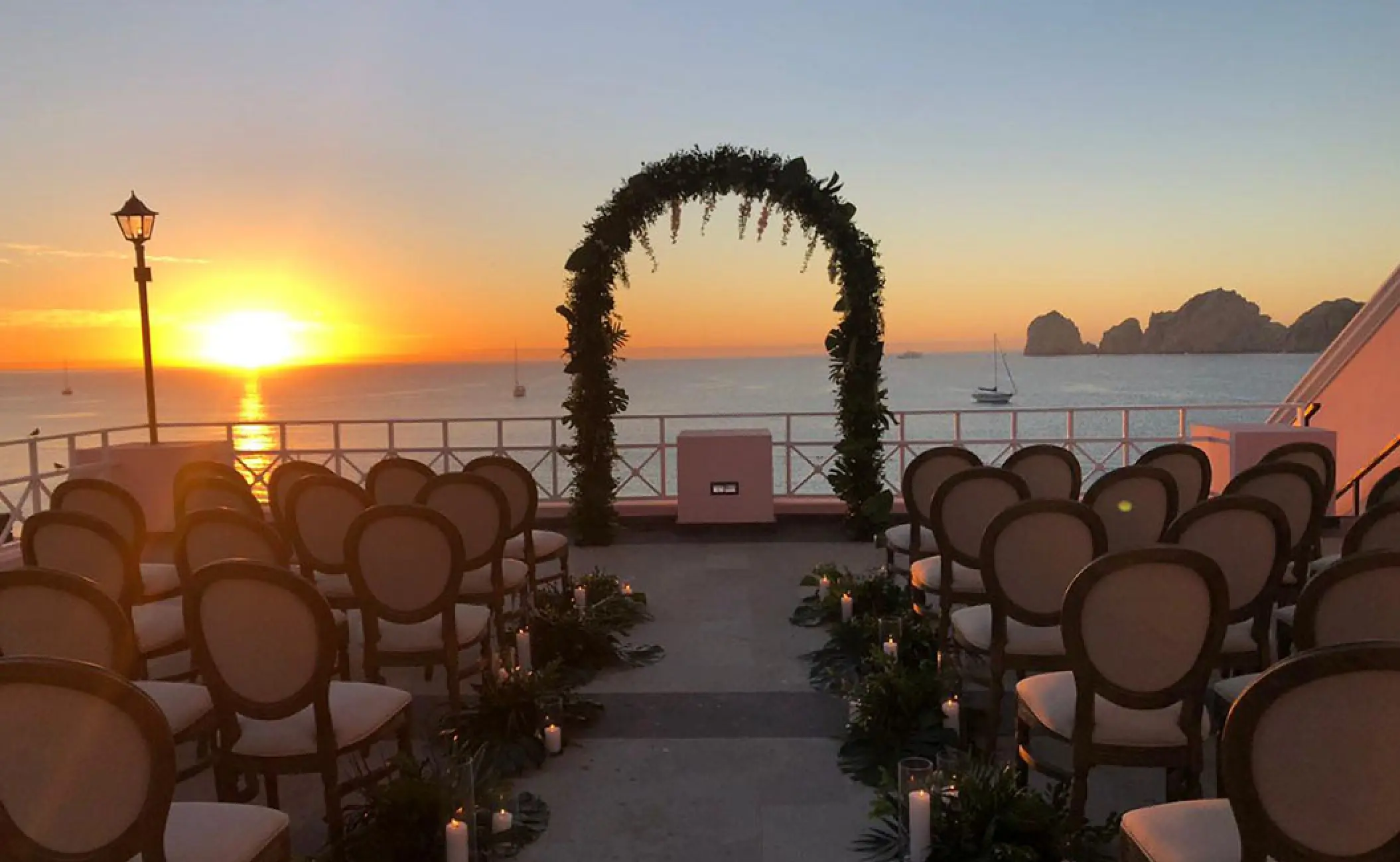 Terrace wedding ceremony setup at sunset at Pueblo Bonito Rose, Cabo San Lucas